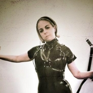 Black Latex and Dressage Whip